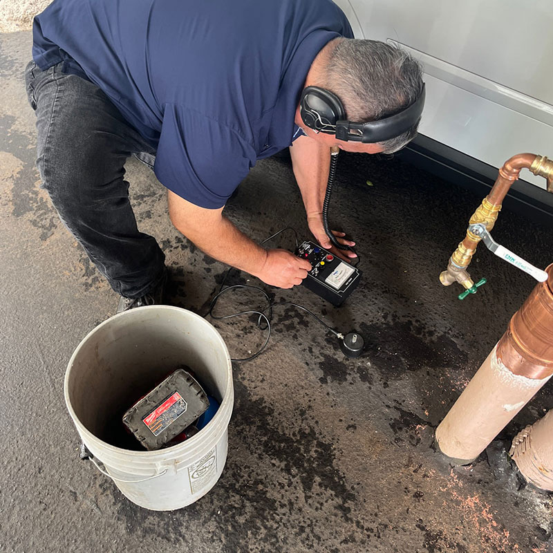 image of Waialae Plumbing tech doing leak detection.